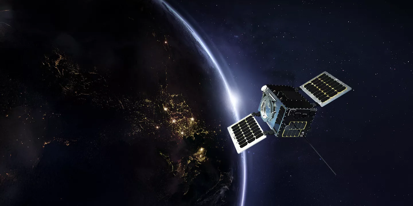 A satellite in space with the Earth in the background