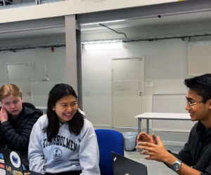 Max Warstrand, Sofie Fu, Swastik Sastha Suresh from team NerdHerd Three happy students.